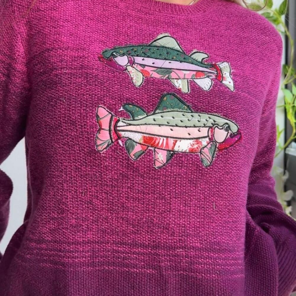 upcycled textured sweater with two embroidered fish patchwork graphics